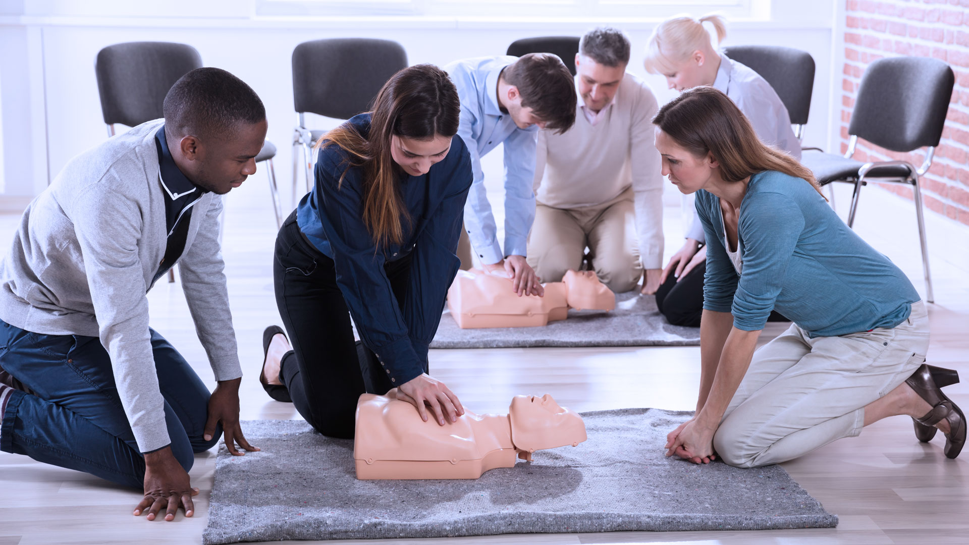 people learning CPR