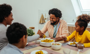 Afro-American family having lunch together at home